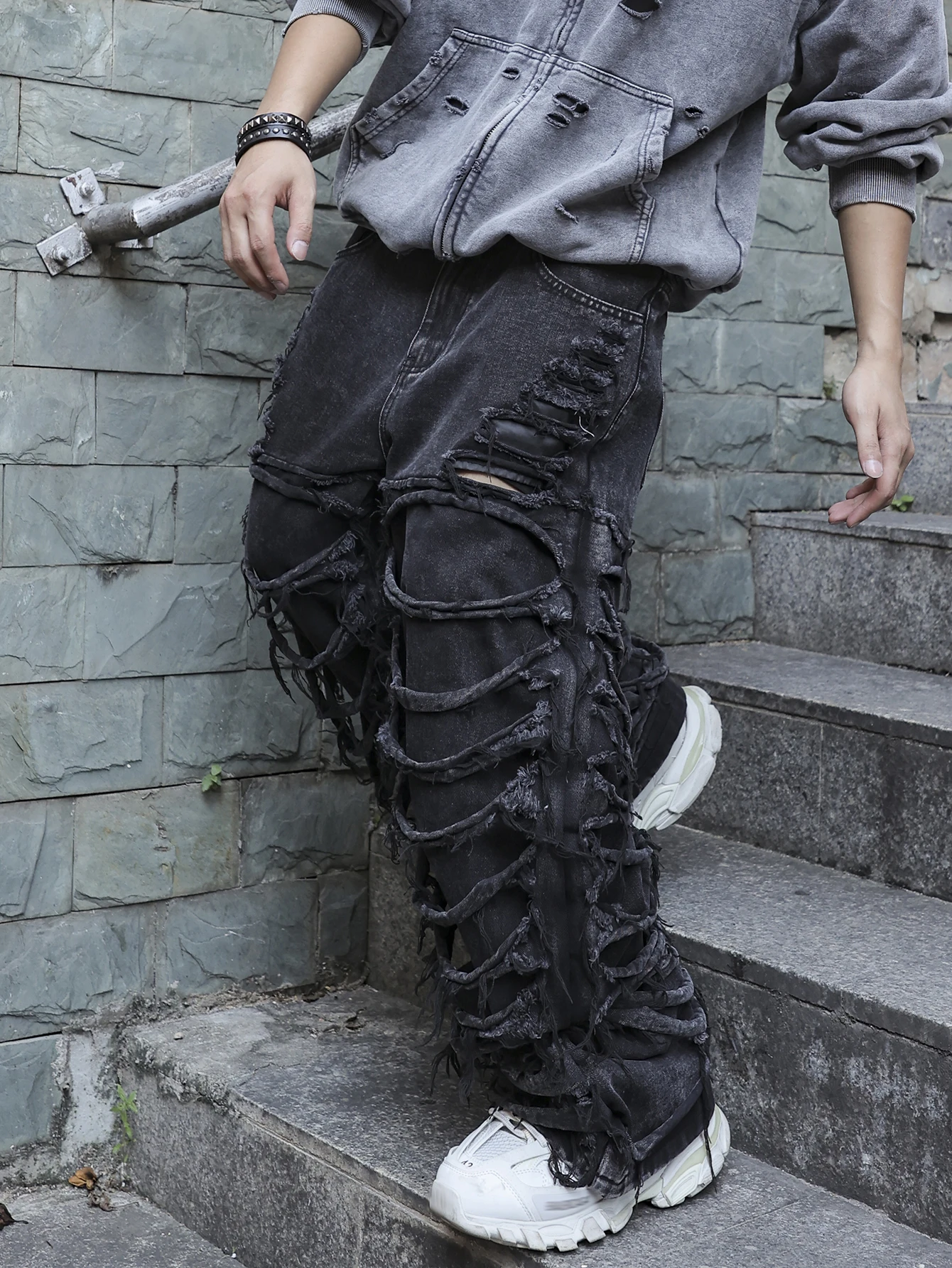 Men's black jeans. With a design of (ripped holes) and tassels. In a street trend style. - Image 3